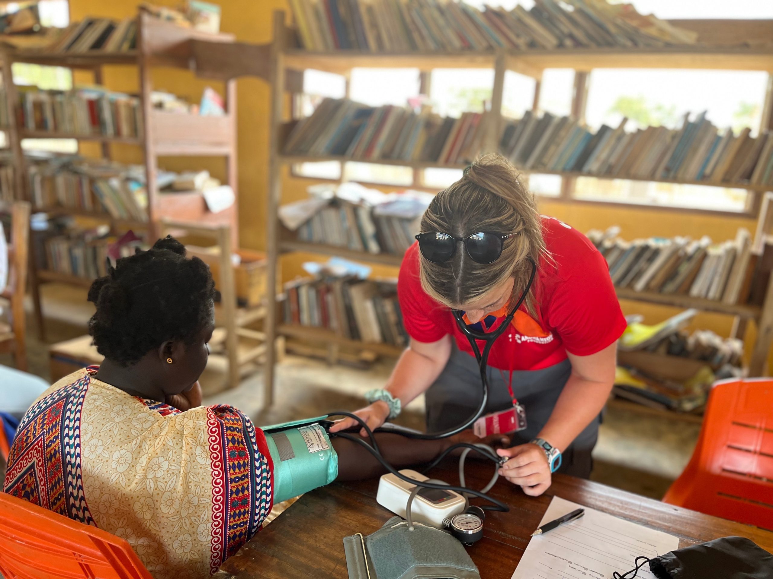 ANF volunteer checking a patient's blood pressure